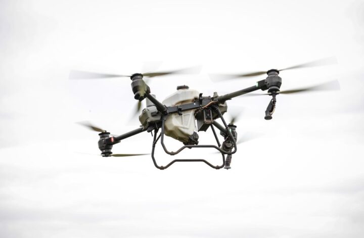 A drone capturing high-resolution aerial data over challenging terrain for mapping and surveying purposes.